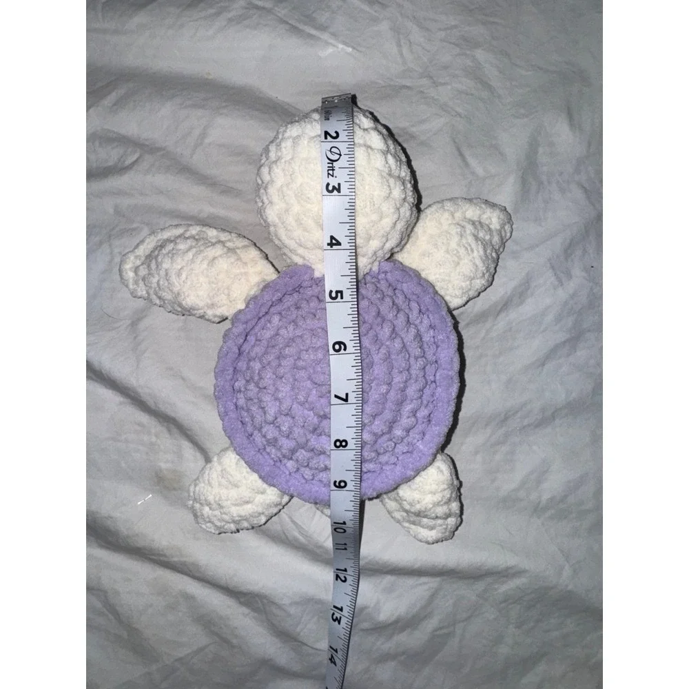 Hand crocheted‎ baby sea turtle white body and lilac purple shell.
